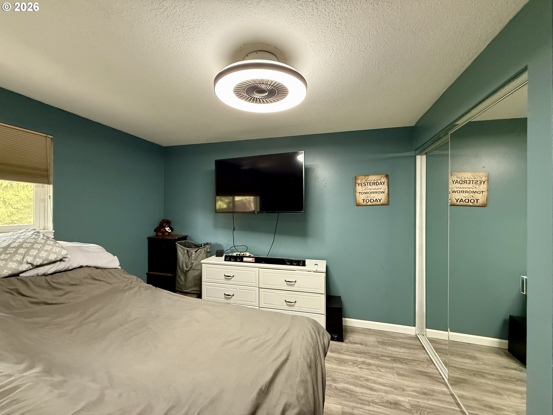105 Timberline Drive Castle Rock, WA 98611 - Photo 13 of 21 a bedroom with a bed and a flat screen tv