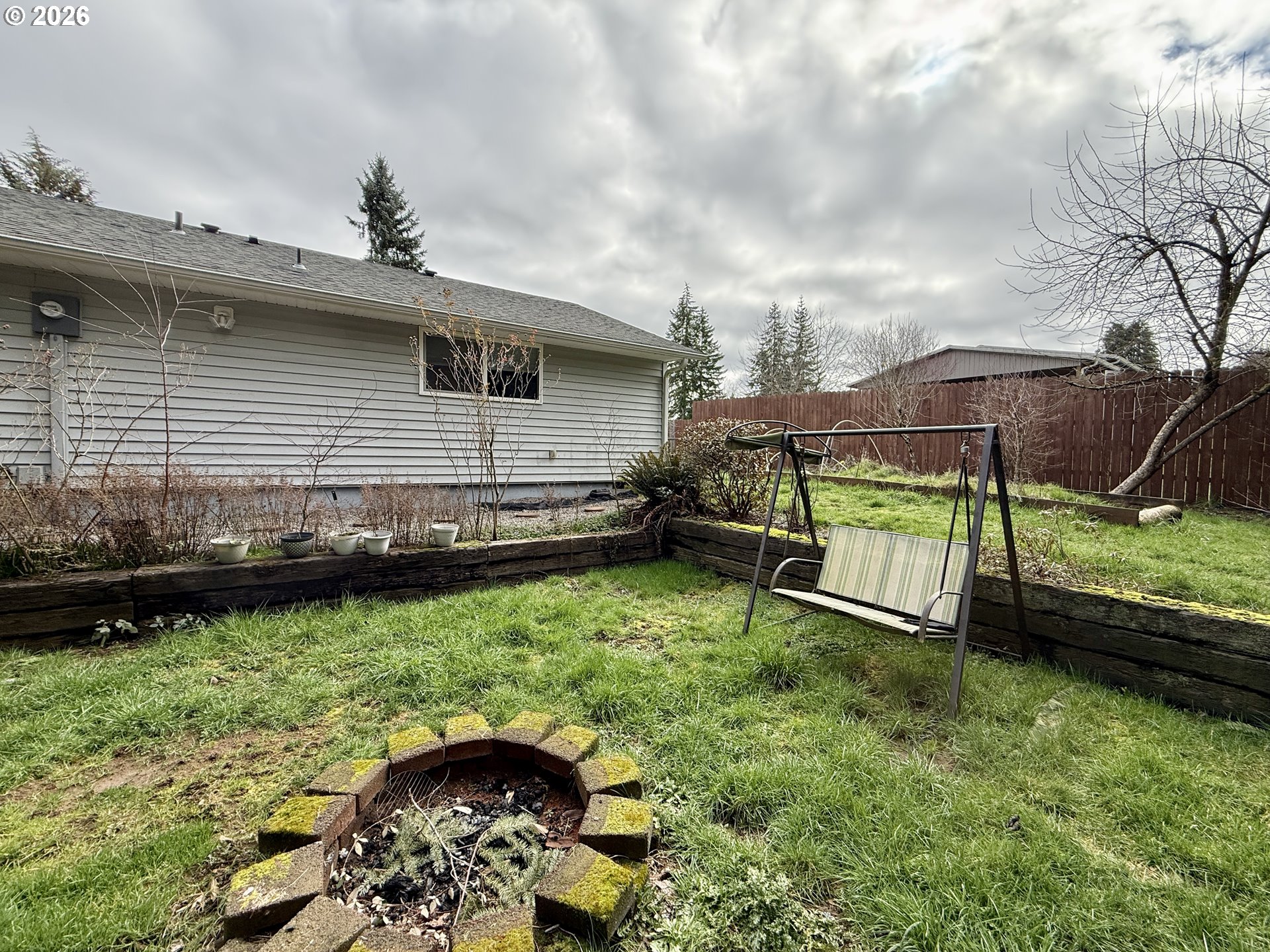 105 Timberline Drive Castle Rock, WA 98611 - Photo 20 of 21 a backyard of a house with lots of green space