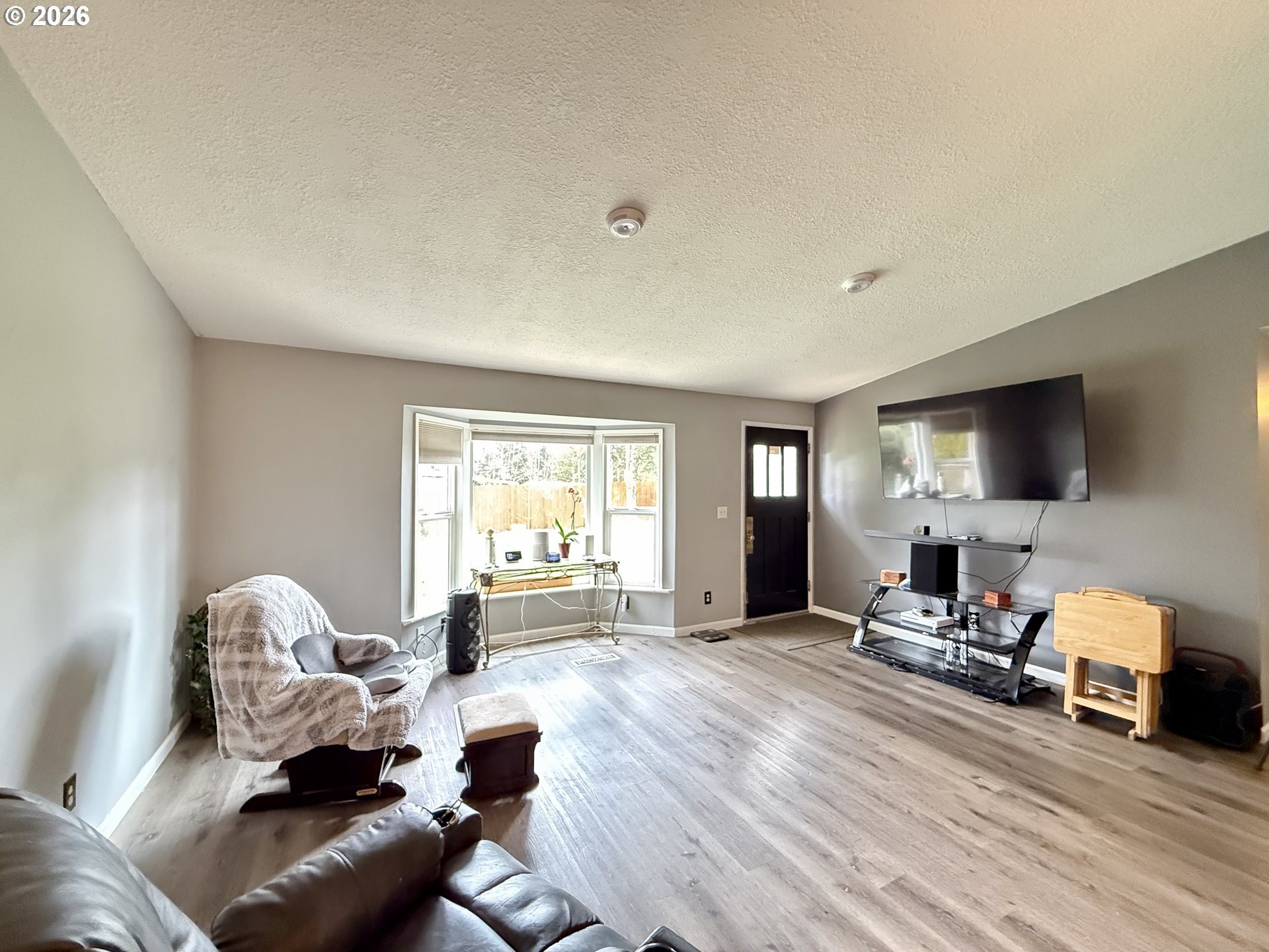 105 Timberline Drive Castle Rock, WA 98611 - Photo 2 of 21 a living room with furniture or couch and a flat screen tv