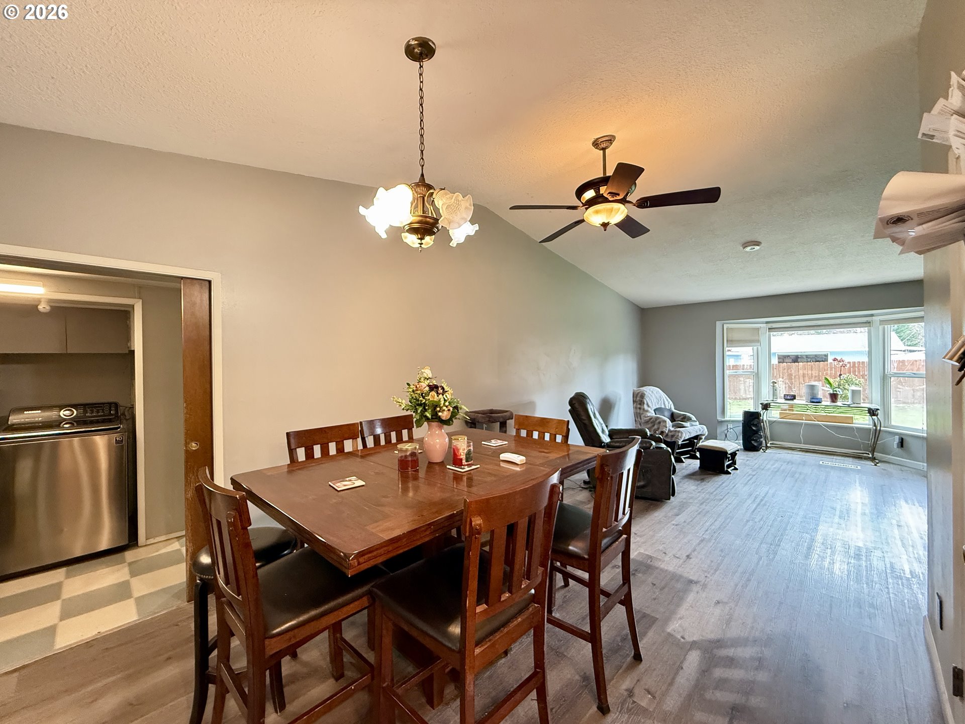 105 Timberline Drive Castle Rock, WA 98611 - Photo 5 of 21 a view of a dining room and livingroom with furniture wooden floor a chandelier