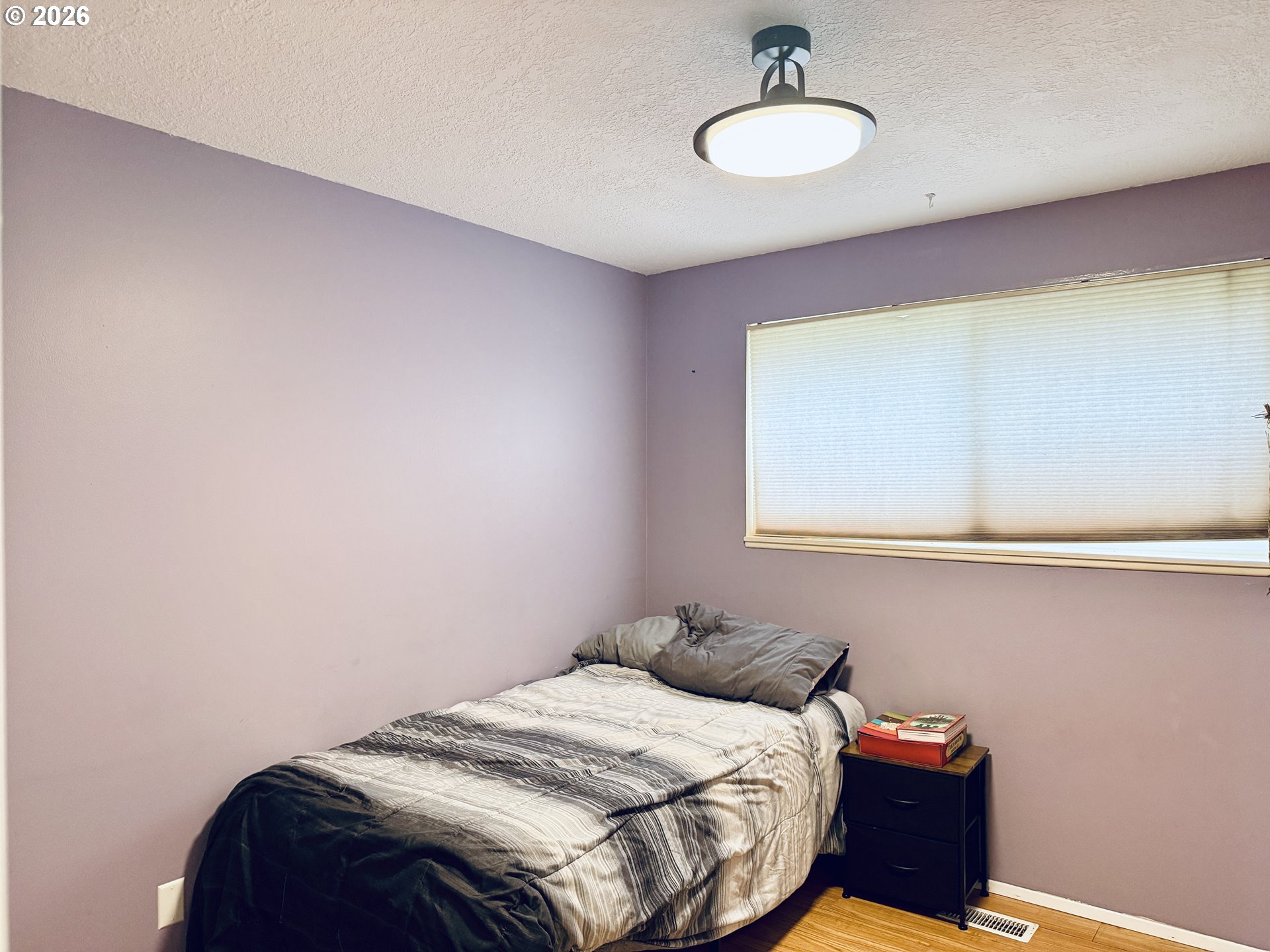105 Timberline Drive Castle Rock, WA 98611 - Photo 9 of 21 a bedroom with a bed and a ceiling fan