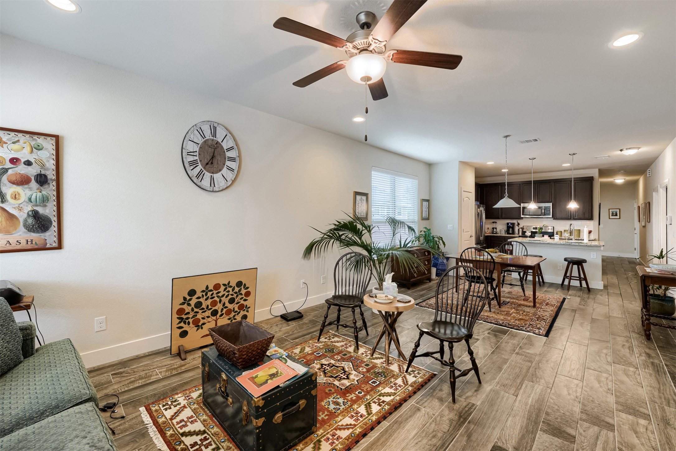 418 High Tech Drive Georgetown, TX 78626 - Photo 6 of 34 Open-concept living space featuring wood-finish flooring and recessed lighting