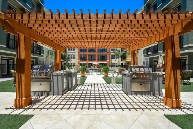 a living room with furniture gym equipment and a mirror