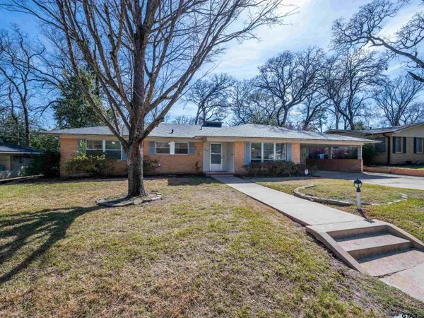 a view of house with outdoor space and swimming pool