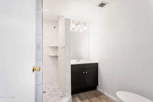 a bathroom with a sink and mirror