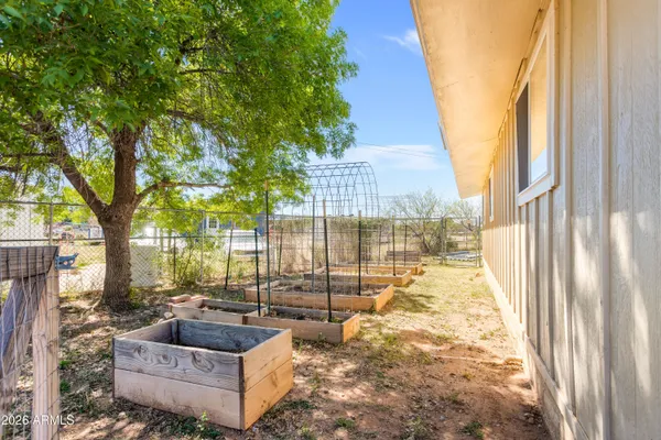 a view of yard covered with snow in front of house