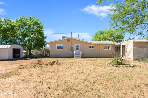 a view of a backyard of the house