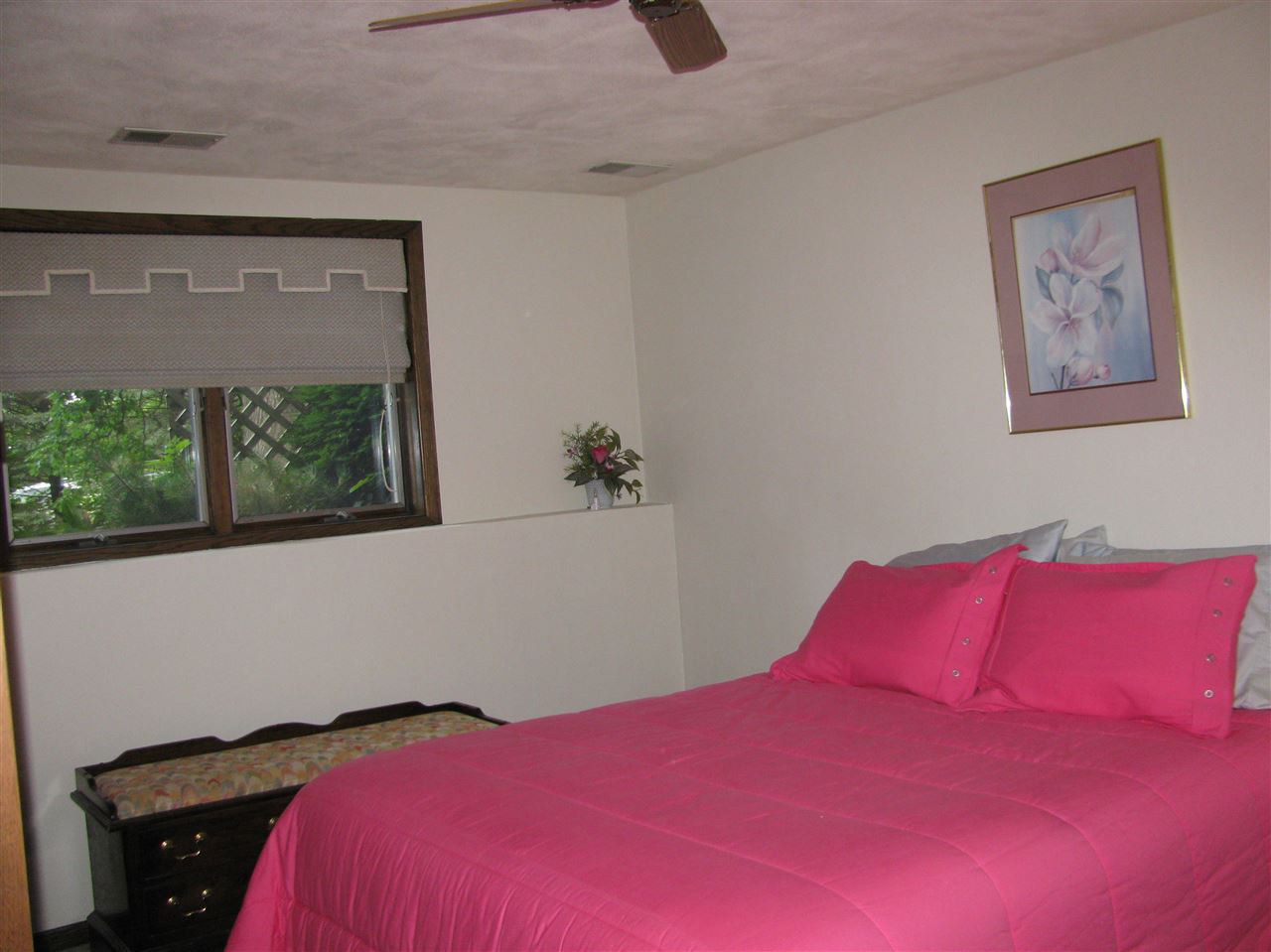 572 Baintree Road Lake Summerset, IL 61019 - Photo 23 of 24 a bedroom with a bed and a painting on the wall
