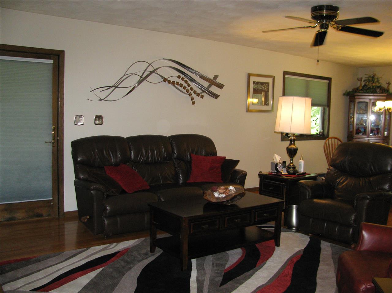 572 Baintree Road Lake Summerset, IL 61019 - Photo 7 of 24 a living room with furniture a lamp and a window