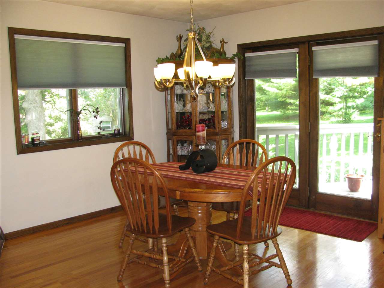 572 Baintree Road Lake Summerset, IL 61019 - Photo 8 of 24 a dining room with furniture a large window and a chandelier