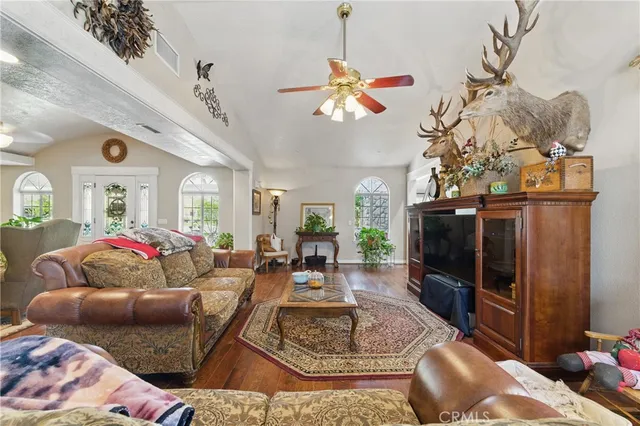 a living room with furniture a fireplace and a table