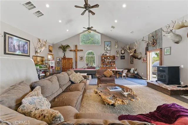 a view of a house with backyard porch and sitting area