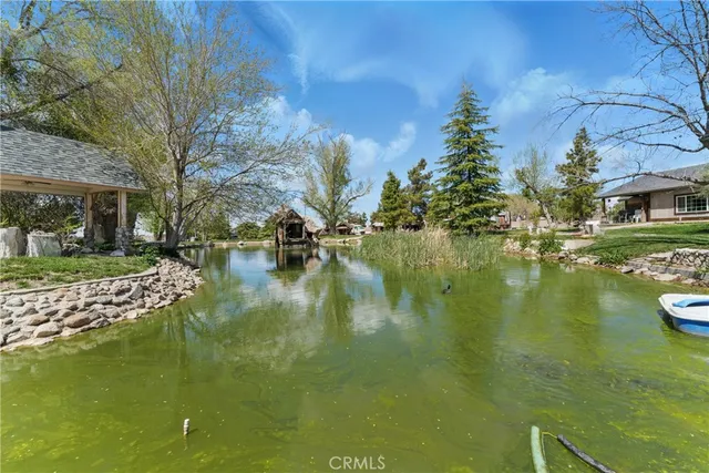 a view of a water fountain in front of house
