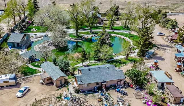 a view of a house with a yard and porch