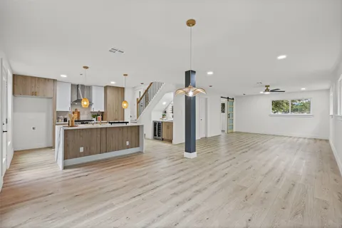 a view of kitchen with furniture and wooden floor
