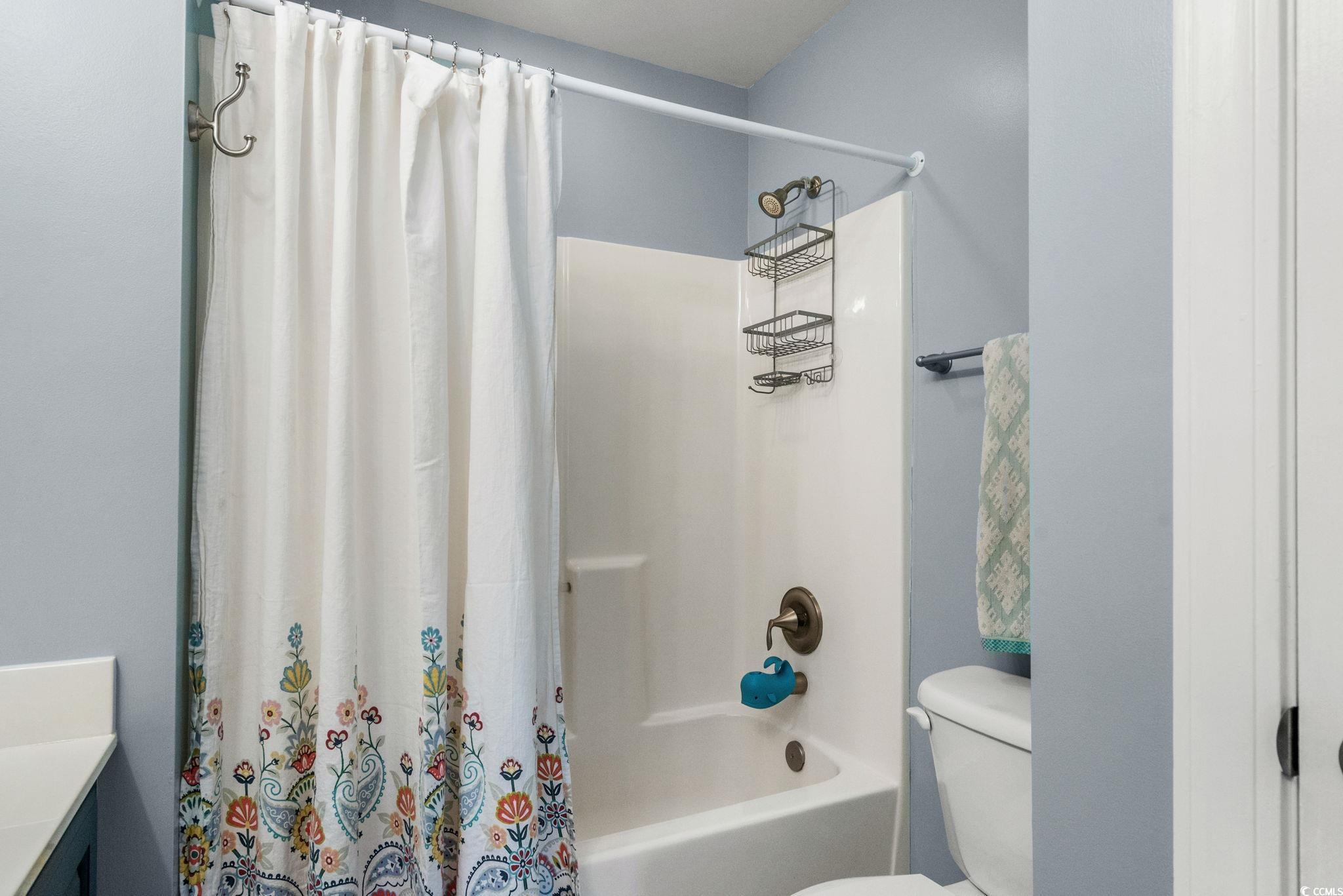 318 Barlow Court Conway, SC 29526 - Photo 24 of 36 Bathroom featuring shower / bath combination with curtain and vanity