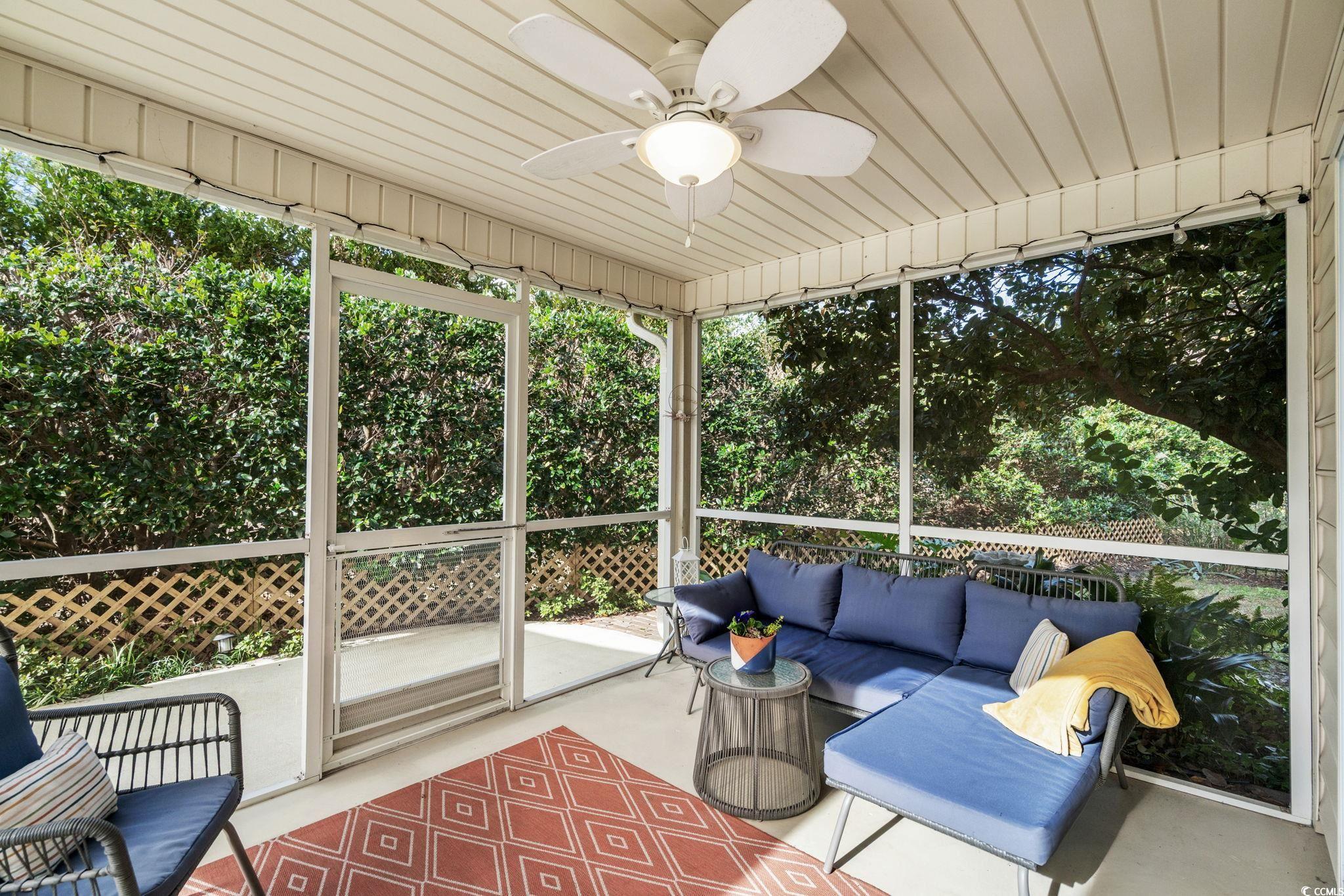318 Barlow Court Conway, SC 29526 - Photo 25 of 36 Screened in porch with an outdoor hangout area and ceiling fan