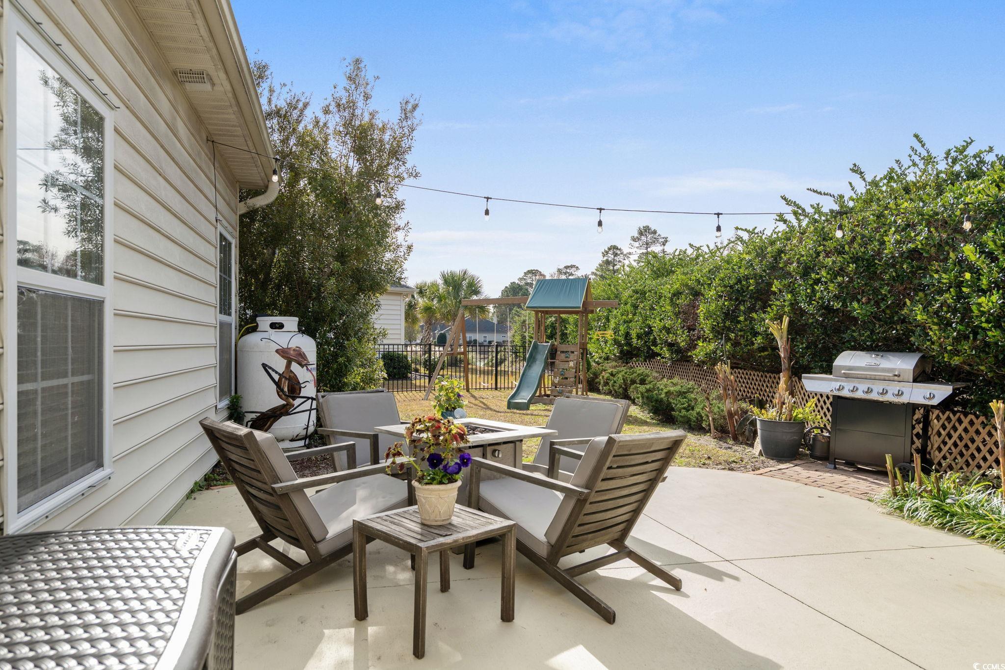 318 Barlow Court Conway, SC 29526 - Photo 28 of 36 Fenced backyard featuring a patio area, a playground, and area for grilling