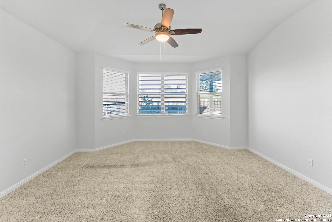 13223 Prospector Way St. Hedwig, TX 78152 - Photo 19 of 30 a view of an empty room with a window