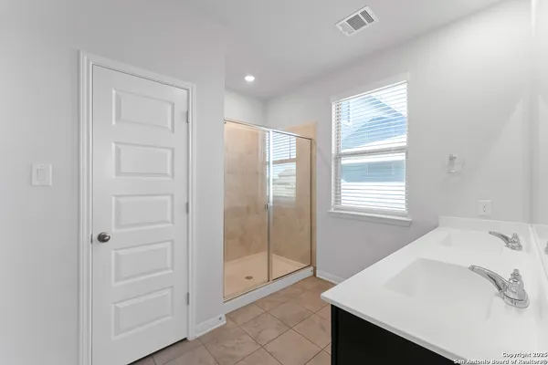 a bathroom with a bathtub and a sink