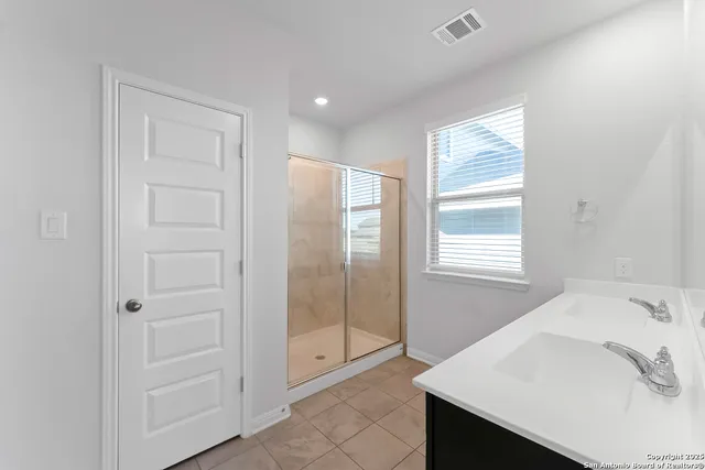 a bathroom with a bathtub and a sink