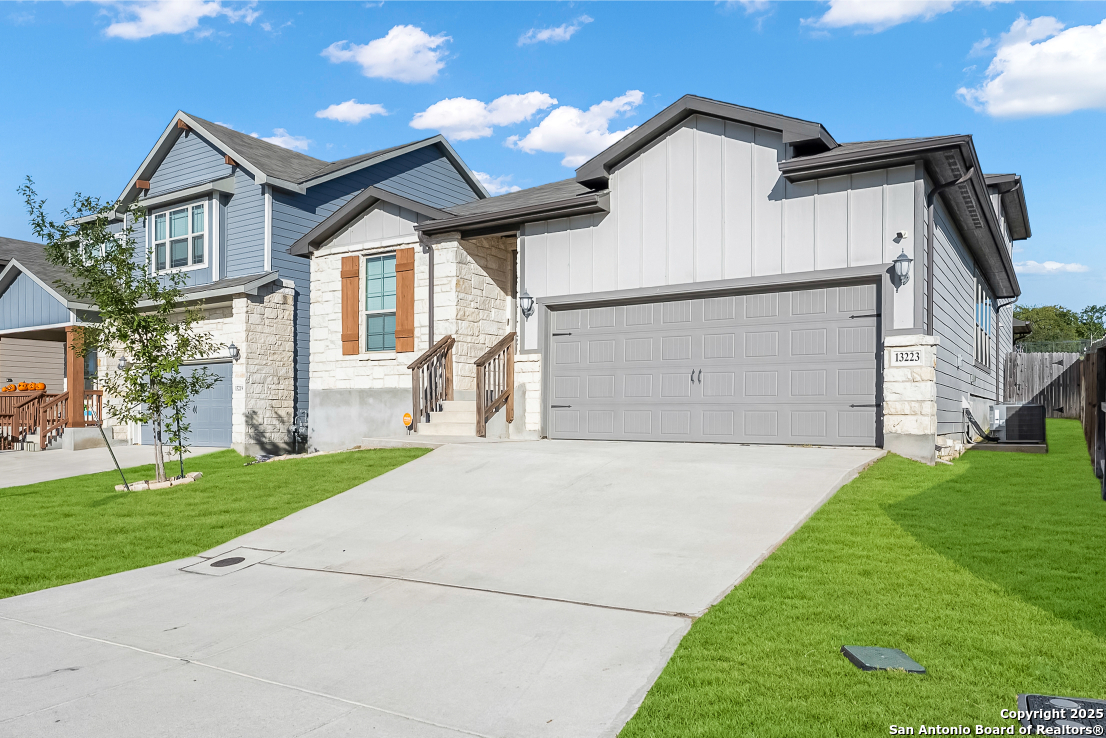 13223 Prospector Way St. Hedwig, TX 78152 - Photo 2 of 30 a view of an house with backyard and garden