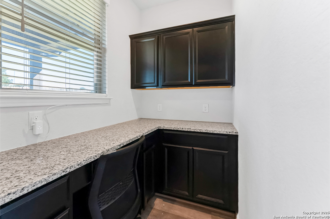 13223 Prospector Way St. Hedwig, TX 78152 - Photo 22 of 30 a kitchen with a sink and a cabinets