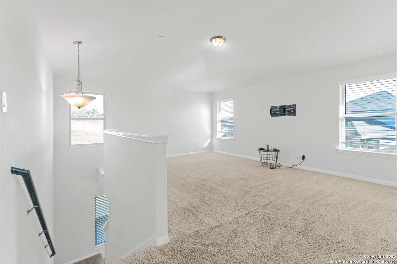 13223 Prospector Way St. Hedwig, TX 78152 - Photo 23 of 30 a view of an empty room with windows