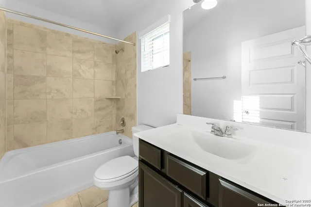 a bathroom with a sink a toilet and a bathtub