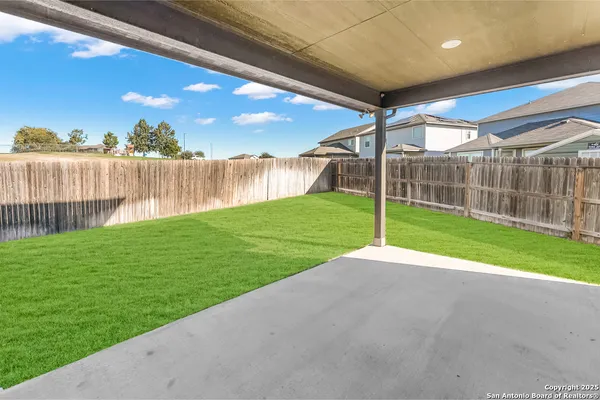a view of a deck with a yard