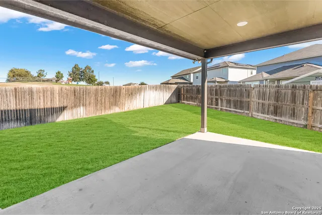 a view of a deck with a yard