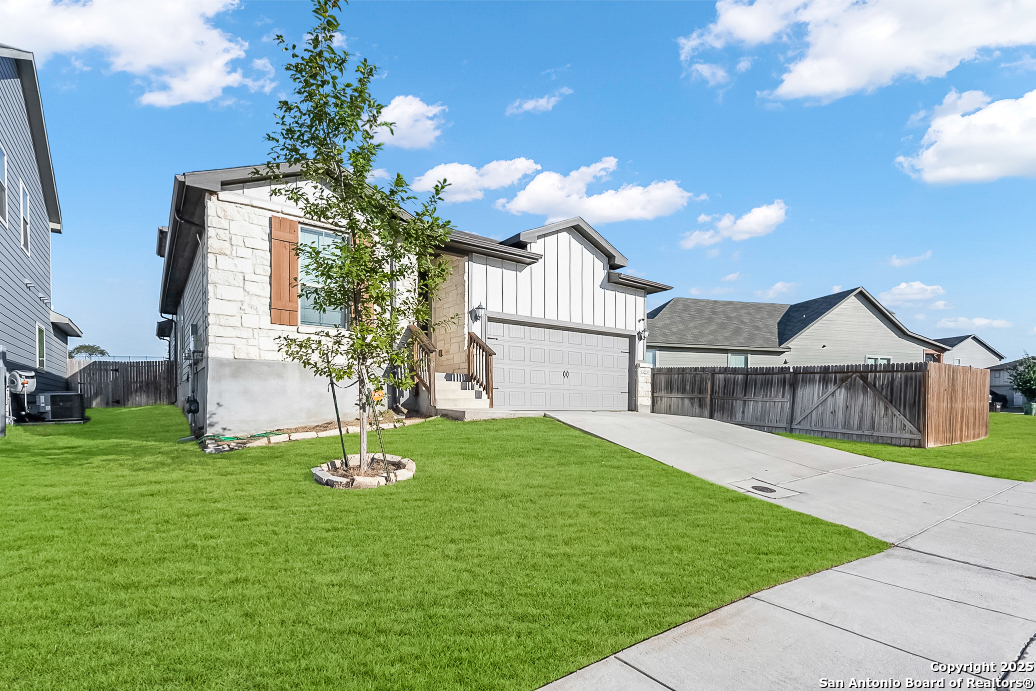 13223 Prospector Way St. Hedwig, TX 78152 - Photo 3 of 30 a front view of a house with garden