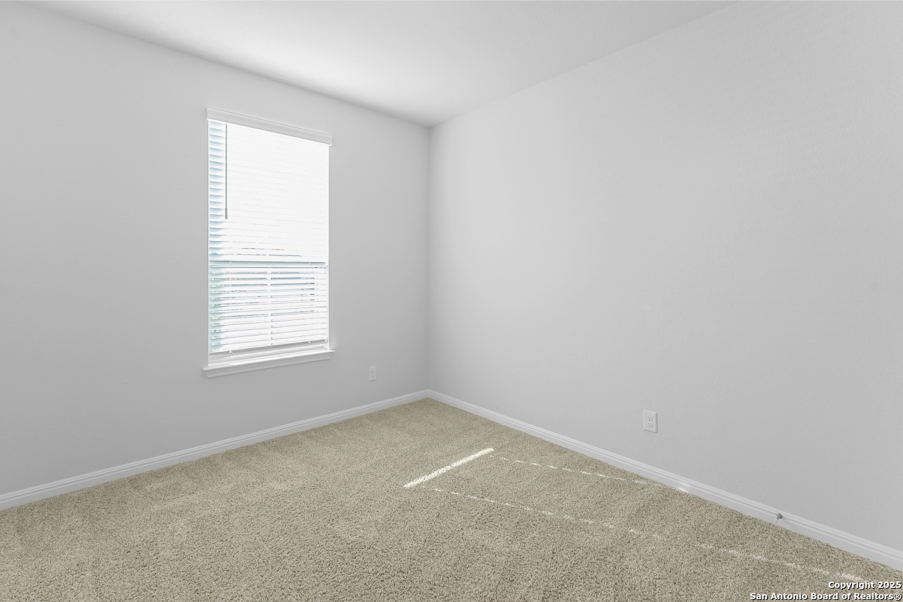 13223 Prospector Way St. Hedwig, TX 78152 - Photo 5 of 30 an empty room with a window