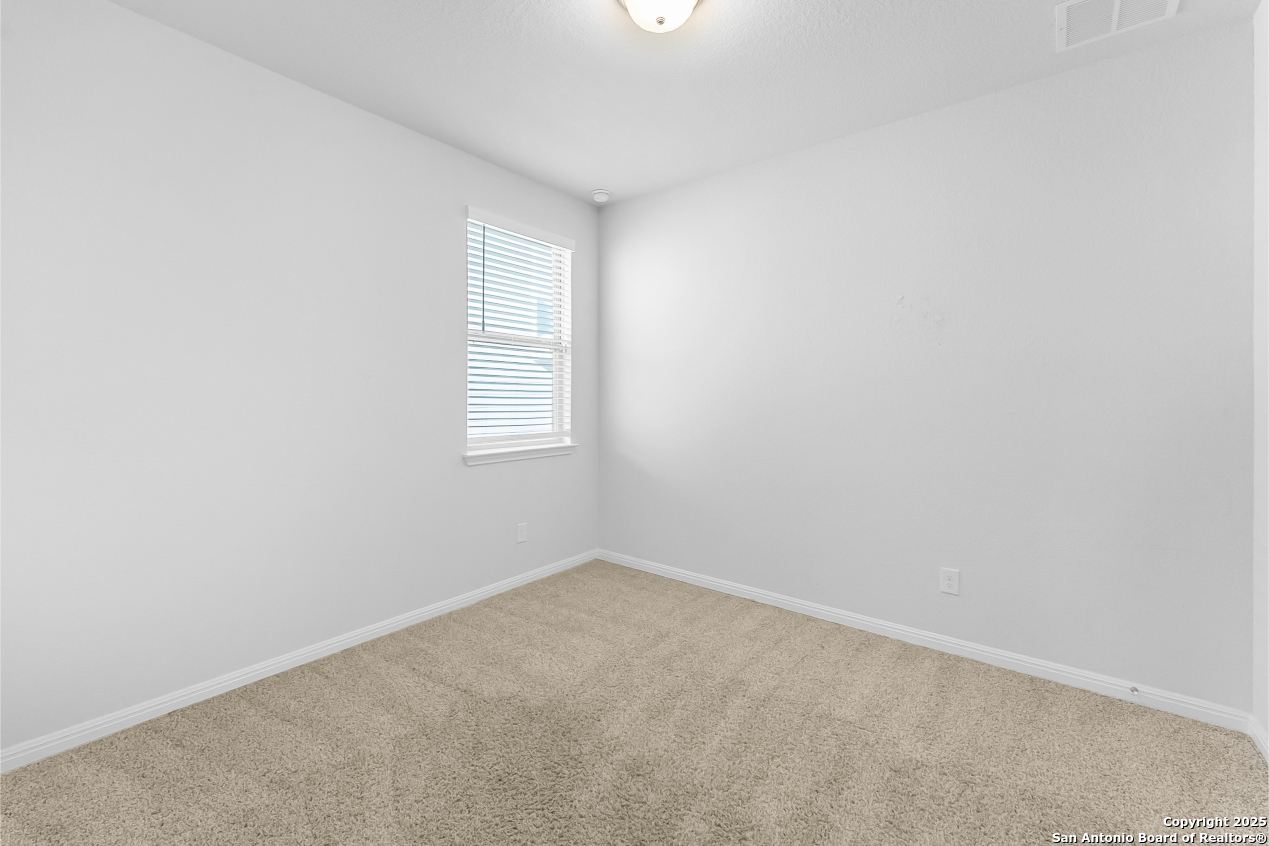 13223 Prospector Way St. Hedwig, TX 78152 - Photo 7 of 30 an empty room with a window