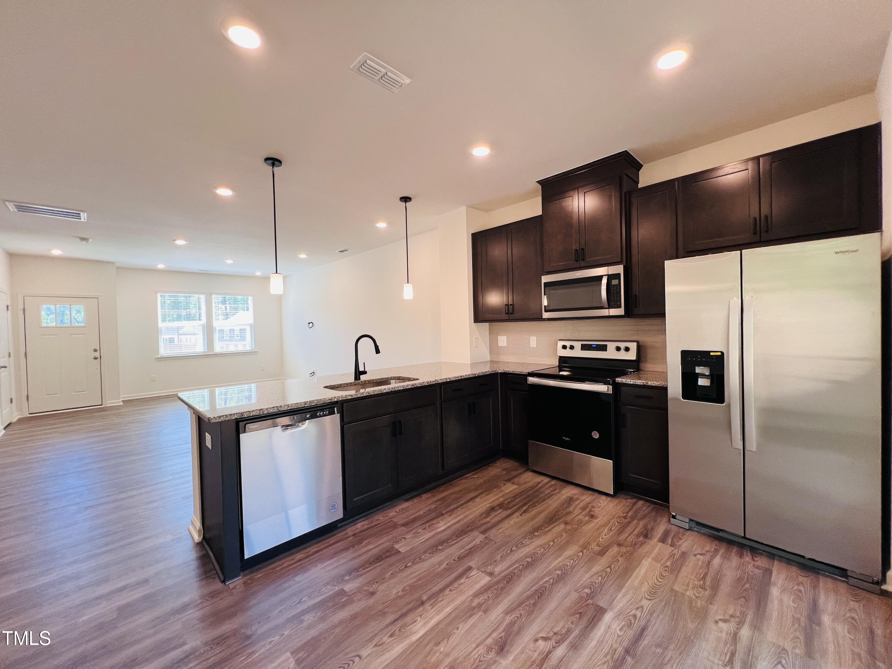 311 Hacksaw Trail Raleigh, NC 27610 - Photo 2 of 20 kitchen and living area in 95