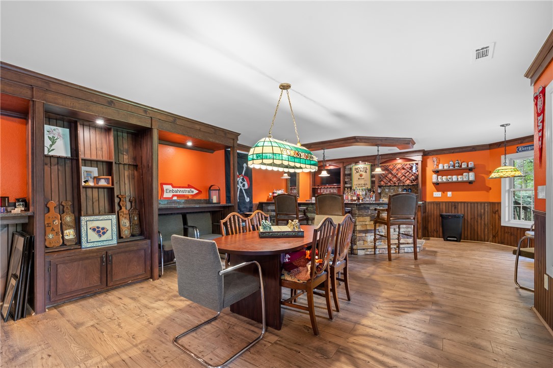 106 Red Maple Way Clemson, SC 29631 - Photo 31 of 49 Rich wood floors and extensive custom built-ins define this versatile lower level entertaining space.