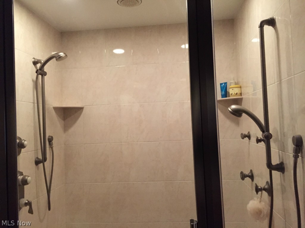 2205 Plymouth Ridge Road Ashtabula, OH 44004 - Photo 14 of 23 Master Bedroom ceramic shower with 7 shower heads including the ceiling shower cap