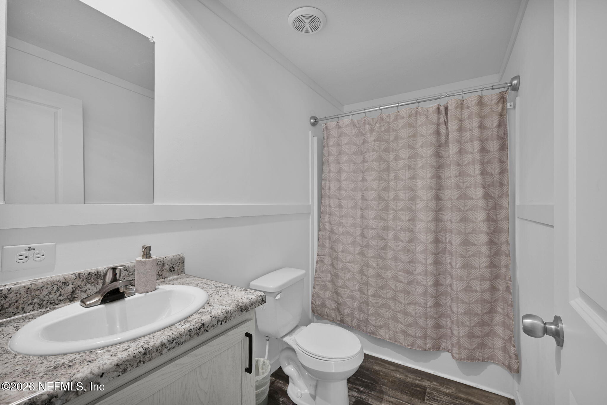 540783 Lem Turner Road Callahan, FL 32011 - Photo 23 of 36 a bathroom with a granite countertop sink toilet and a mirror