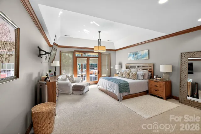 a spacious bedroom with a large bed and a couch