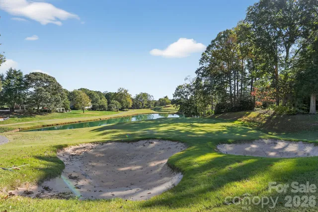 a view of a golf course with a lake view