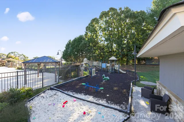 a view of a backyard with sitting area