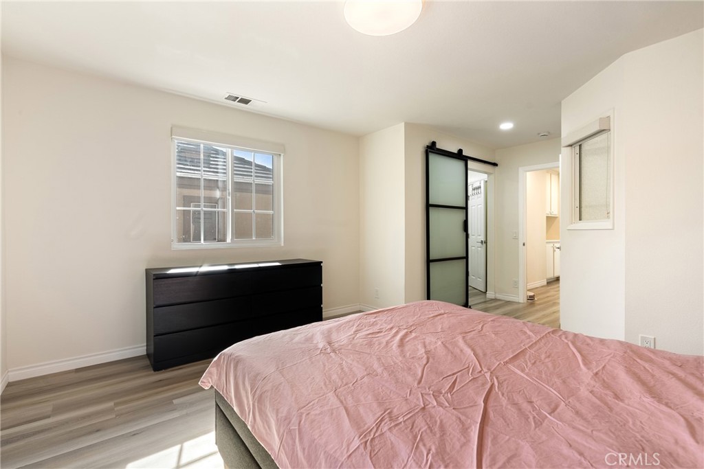 24 Rue De Nicole Lake Forest, CA 92610 - Photo 13 of 24 a bedroom with a bed and a window