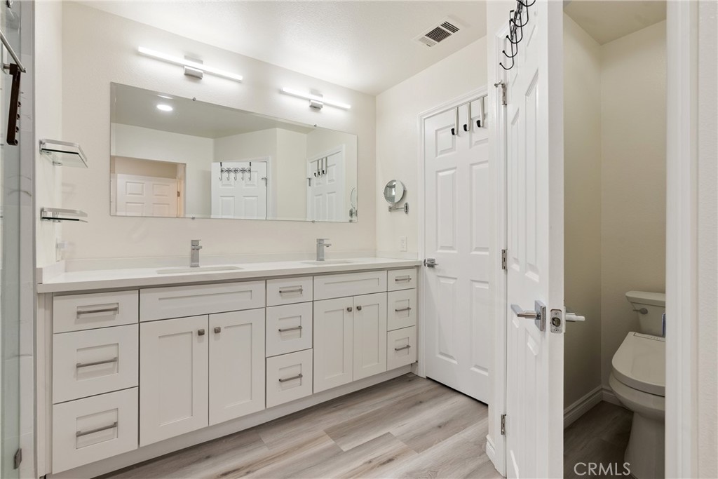 24 Rue De Nicole Lake Forest, CA 92610 - Photo 14 of 24 a spacious bathroom with a double vanity sink a toilet and a shower