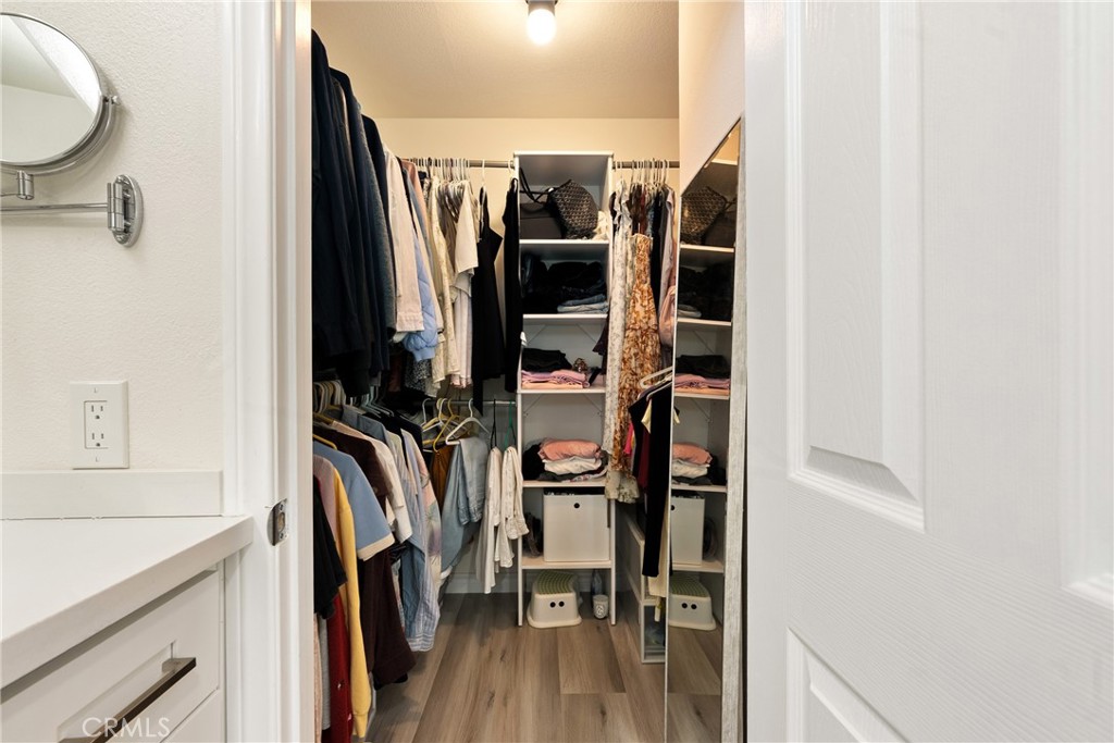 24 Rue De Nicole Lake Forest, CA 92610 - Photo 16 of 24 a view of walk in closet with clothes and shoes