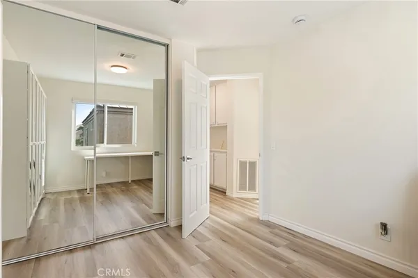an entryway of a house and an empty room