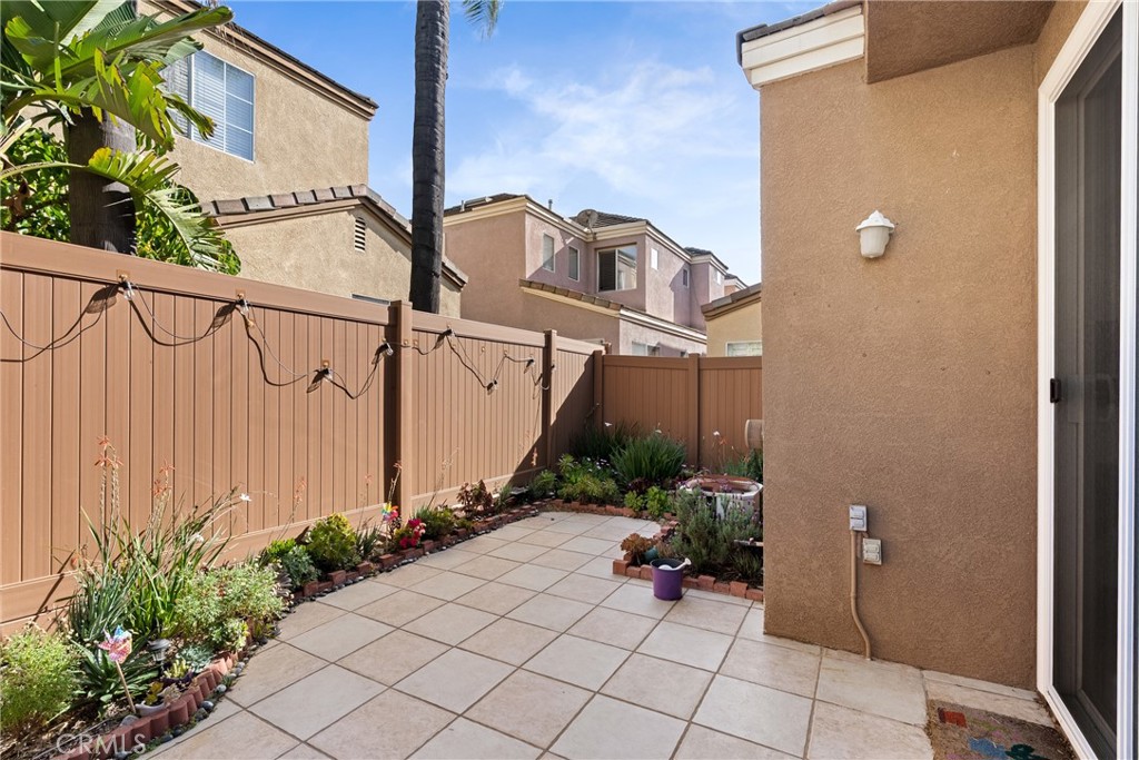 24 Rue De Nicole Lake Forest, CA 92610 - Photo 22 of 24 a view of a house with backyard and garden