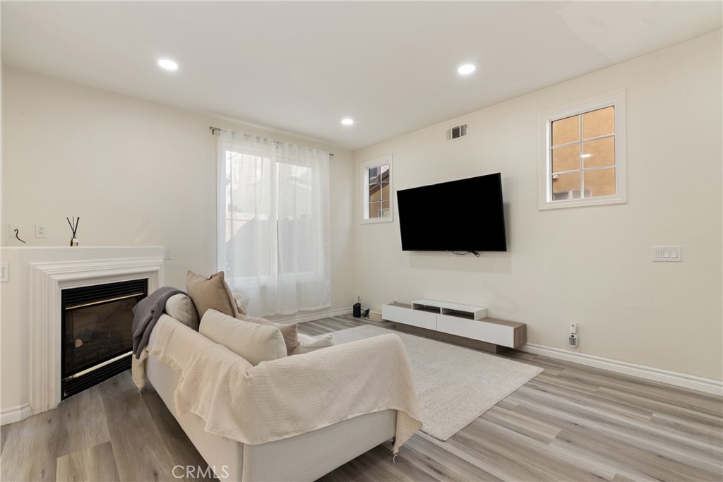 24 Rue De Nicole Lake Forest, CA 92610 - Photo 5 of 24 a living room with furniture and a flat screen tv