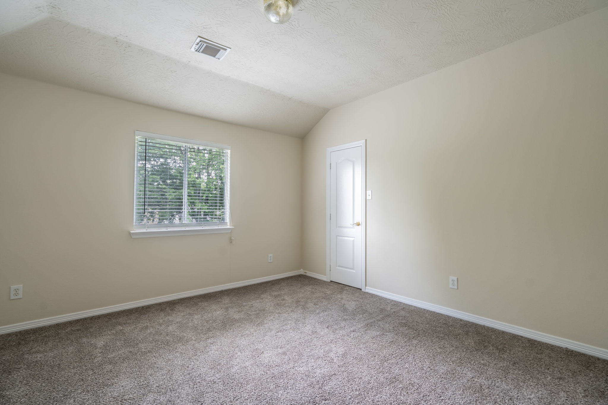 24139 Spring Sunset Drive Spring, TX 77373 - Photo 18 of 26 an empty room with windows