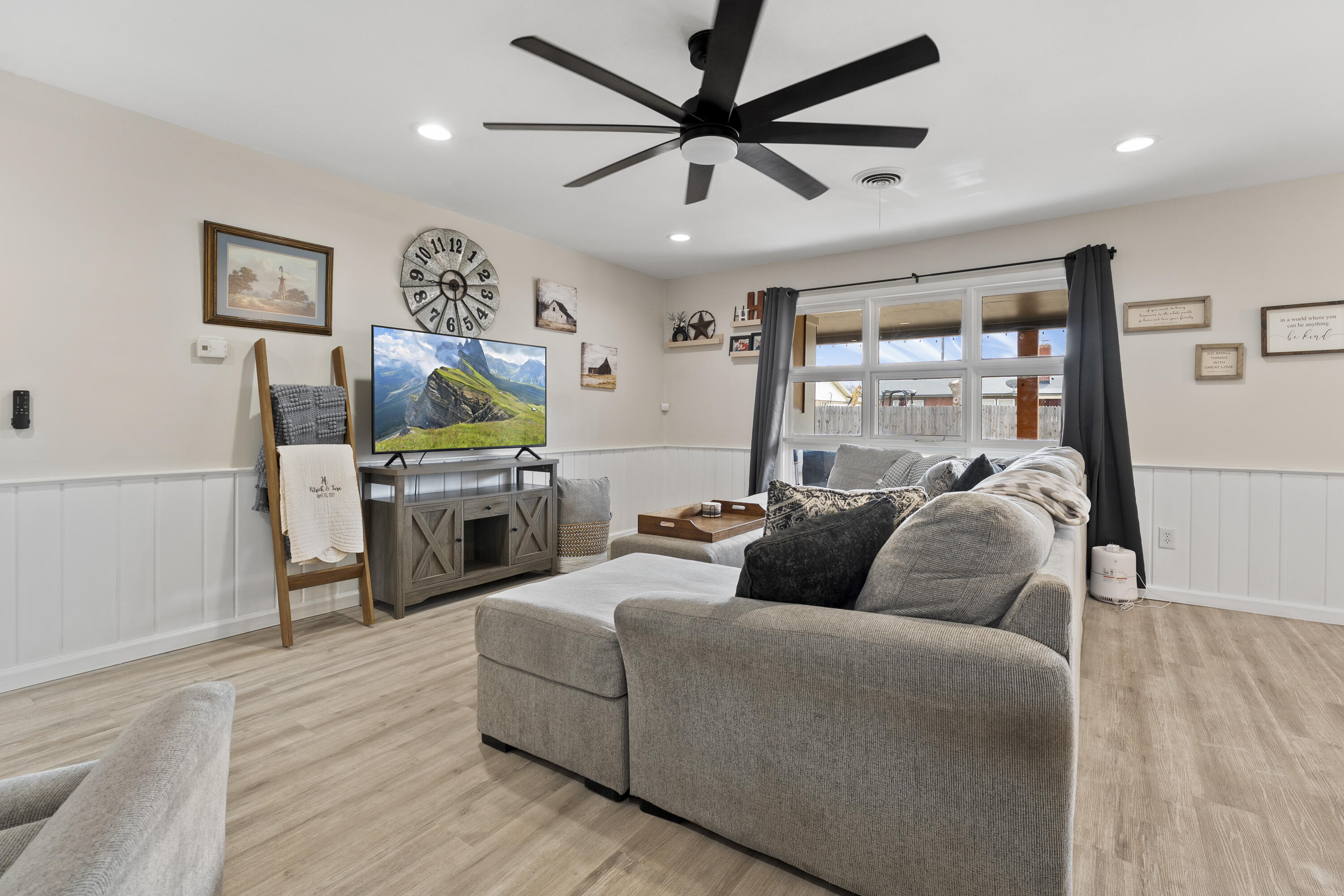 3703 41st Street Lubbock, TX 79413 - Photo 12 of 21 a living room with furniture and a flat screen tv