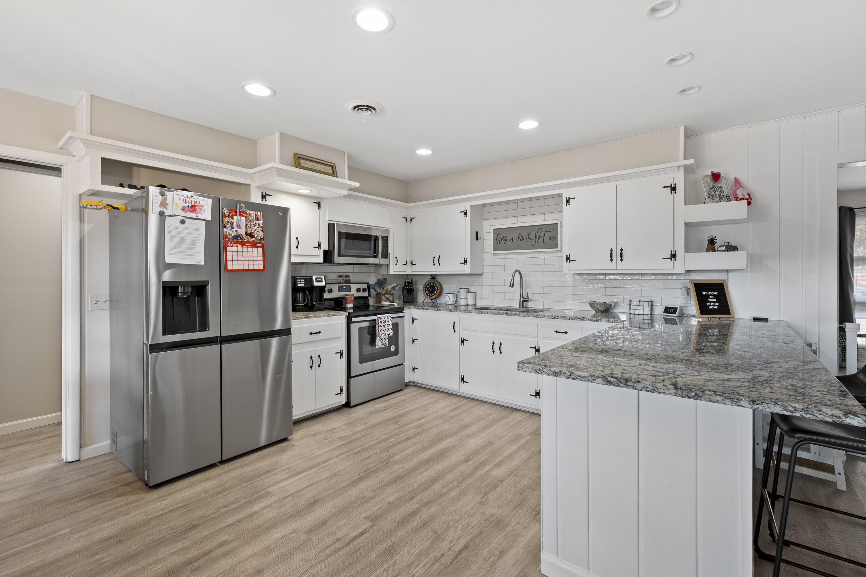 3703 41st Street Lubbock, TX 79413 - Photo 15 of 21 a kitchen with stainless steel appliances granite countertop a refrigerator sink and cabinets